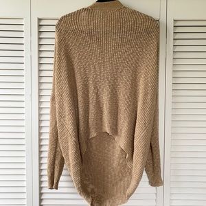 Golden brown sweater, open cross cross in the back